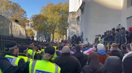 Clashes break out between police and crowds waving St George's flags as they try to reach Whitehall in London, UK