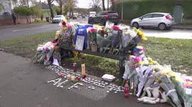 Floral tributes cover a bench near home of stabbed Leeds schoolboy in UK