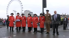 Chelsea Pensioners observe two minute silence on Westminster Bridge, London