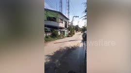 Houses collapse as sinkhole swallows road in Thai neighbourhood