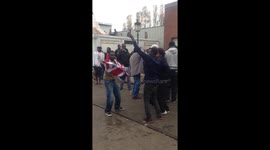 Migrants in Calais Dancing with the British Flag