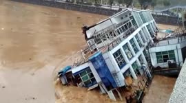 Abandoned barges crash into China bridge after rainfall