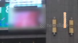 Porn played on giant, public advertising screen by mistake in China