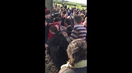 Bottle kicking match takes place on mile-long pitch in English village