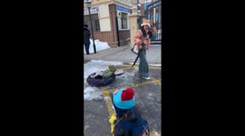 Parents transform winter commute with unique inflatable sledges for children in China