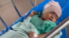 Crazed wild monkeys climb into baby's crib and bite his skull in Thailand