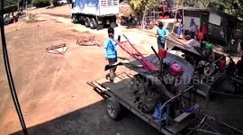 Tractor engine explodes and topples from trailer cart