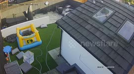 Hilarious footage captures moment dad falls off roof while cleaning windows