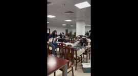 University students team up to round up rat in library without making a sound in Southern China