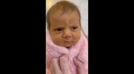 What the... to pure joy: Newborn tries out all the funny faces ahead of photoshoot