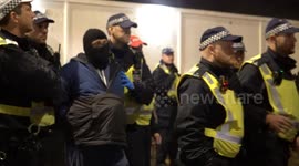 Masked Man arrested by police after attempting to join the Palestine Protest outside 1o Downing Street