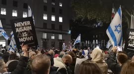 A Christian shows his support for the Jewish people during the Never Again Is Now prayer event held in Whitehall. Saying 