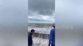 Girl, 14, rescued when wave drags her into stormy sea