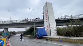Large truck crashes off overpass in Greece