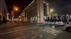 Mounted Gardai patrol Dawson Street amid riots in Dublin, Ireland