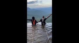Couple Sit On Columbia's Highest Waterfall