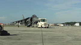 Marines with VMA-223 load Air-to-Air missiles onto Harriers