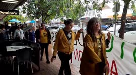 Torrential rally: over 100 brave rain for climate strike in Taree