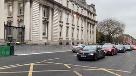 Garda Commissioner visits Irish Parliament protected by a ring of steel following rioting in Dublin