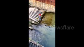 Two women release bizarre offerings by riverside in China