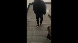 Student shows off quick way to descend stairs in sandals