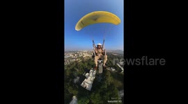 Indian police take to the sky using paramotor to provide overwatch for festival