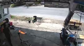 Gas cartridge engulfed in flames at car repair shop