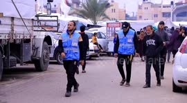 Gazans line up to receive aid arriving as part of Israel-Hamas truce deal