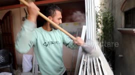 Gaza family tries to clean up destroyed home in visit during weekend truce