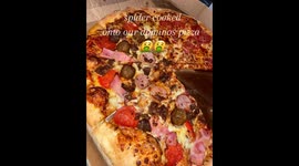 Woman finds dead SPIDER 'cooked into Domino's pizza'