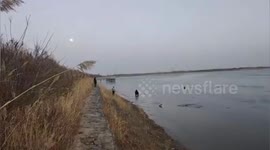 Firefighters and volunteers save two teen boys from frozen lake
