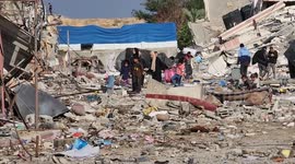 Palestinians searching for their belongings under the rubble of their homes in Gaza
