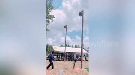 Monkeys race to pluck coconuts from pole during Thai festival