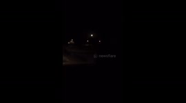 Unknown lights flying by the moon