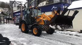 Finally! The local snow-shifting service comes to the rescue in Ambleside!