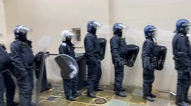 Police in full riot gear arrive to remove squatters who hung a banner calling for a global intifada near Regent’s Park