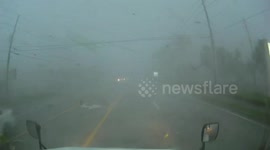Tornado Turns over Truck on Highway