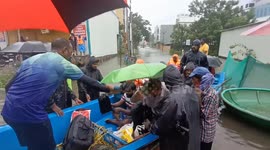 People who were strangled in the flood affected areas were rescued by boats after michaung cyclone hit the Chennai and neighboring districts