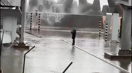 Russian military officer caught by massive sea wave while filming storm