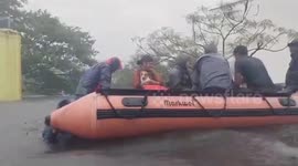 Fire service officials rescue trapped people amid severe flood triggered by Cyclone Michaung in southern India