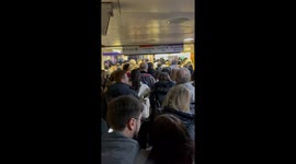Weekend crowd in London underground. at Bond Street