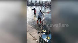 Fishermen rescued after plunging through thin ice on frozen reservoir