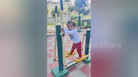 A two year funny boy doing very well excercise with very well blance own self