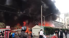 Fire rips through popular tourist market in Bangkok