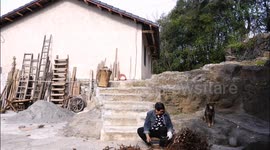 An Elderly Woman Gathers Firewood in Yichang, China