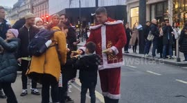 Kind Christmas bikers hand out sweets during festive ride in London's Regent Street