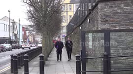 SDLP leader Colum Eastwood walks out of police station after going for 