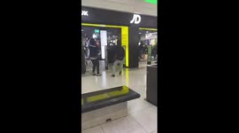 VIDEO: Thug lobs fire extinguisher at man during an ugly brawl in JD Sports store (part 1)