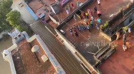 Indian Air Force officials deliver relief material to those stranded in flood in southern India