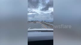 Football flies off car and hits vehicle on opposite lane